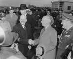 Attlee shaking hands with US Secretary of State James F. Byrnes upon his arrival at National Airport in Washington, 1945