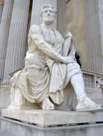 Modern statue representing Tacitus outside the Austrian Parliament Building